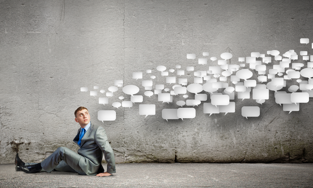 Image of young man sitting on floor. Communication concept Image of young man sitting on floor. Communication concept